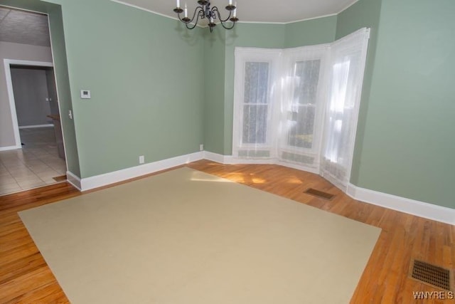 45 S Academy St, Middlebury, NY 14591 - unfurnished dining area featuring a chandelier, wood finished floors, and ornamental molding
