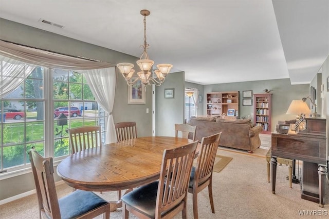 34 Northfield Pl, Amherst, NY 14226 - dining room featuring light colored carpet and a chandelier