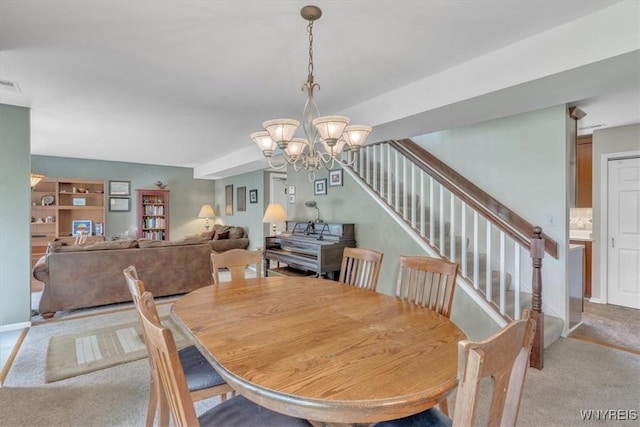 34 Northfield Pl, Amherst, NY 14226 - carpeted dining room with a chandelier and stairway