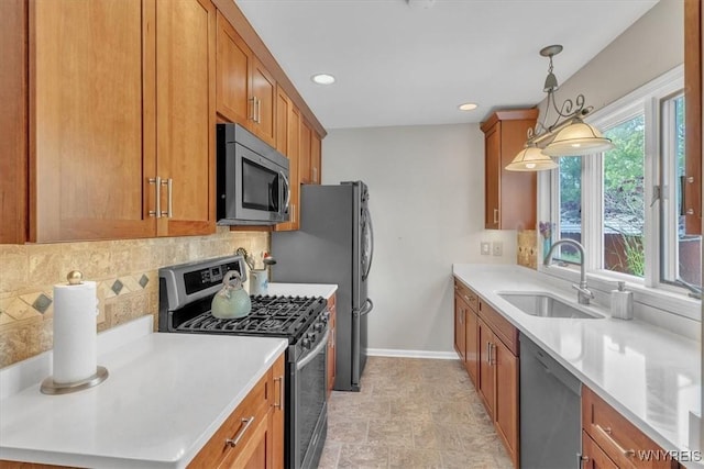 34 Northfield Pl, Amherst, NY 14226 - kitchen with stainless steel appliances, backsplash, brown cabinetry, light countertops, and recessed lighting