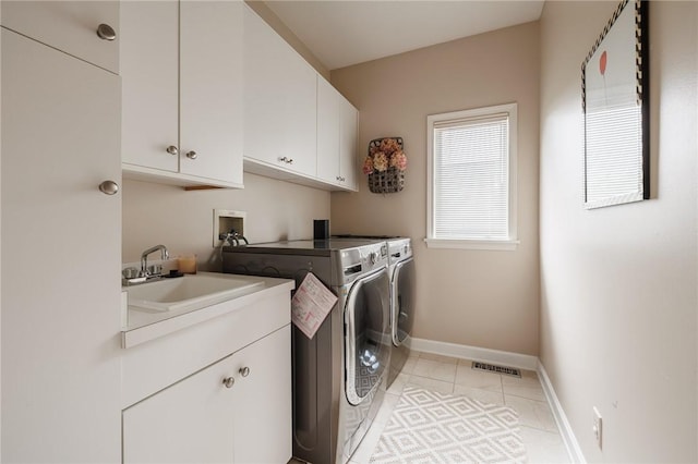 31 Spruce Rdg, Perinton, NY 14450 - washroom with independent washer and dryer, cabinet space, and light tile patterned floors