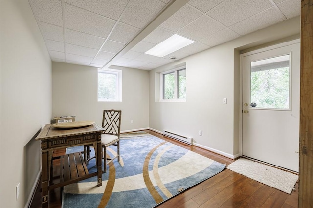 31 Spruce Rdg, Perinton, NY 14450 - home office with baseboard heating, wood-type flooring, and a drop ceiling