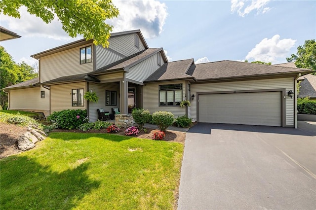 31 Spruce Rdg, Perinton, NY 14450 - view of front of house with driveway, a front yard, a garage, and a shingled roof