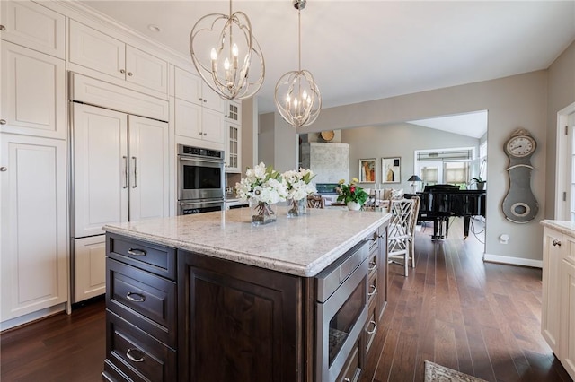 31 Spruce Rdg, Perinton, NY 14450 - kitchen featuring built in appliances, a chandelier, dark wood-style floors, white cabinets, and glass insert cabinets