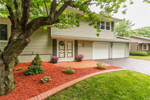 218 Fox Hall Dr, Irondequoit, NY 14609 - split level home with asphalt driveway and a garage