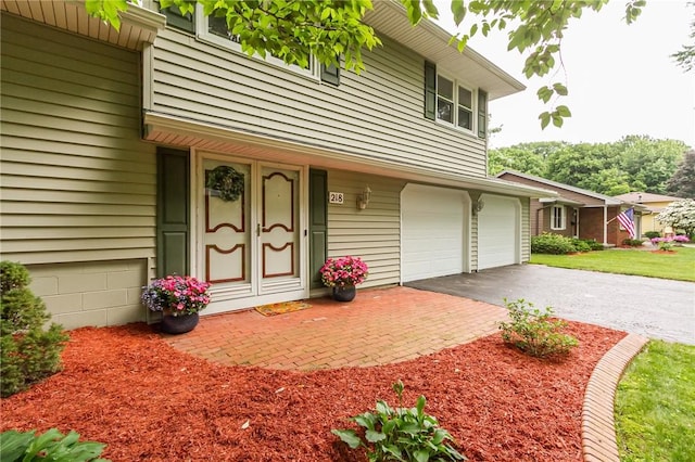 218 Fox Hall Dr, Irondequoit, NY 14609 - entrance to property with an attached garage and driveway