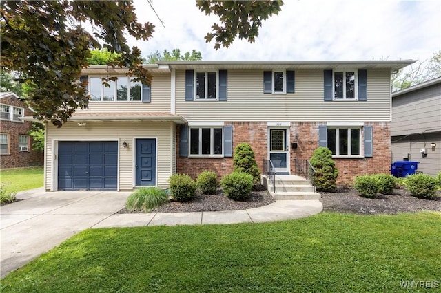 338 Allendale Rd, West Seneca, NY 14224 - view of front of house with an attached garage, a front yard, and brick siding