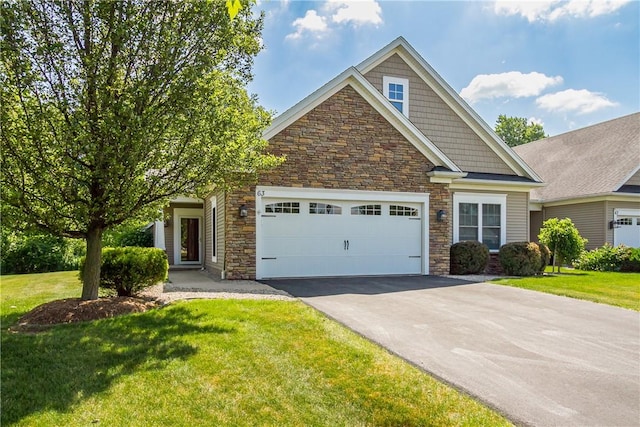 63 Balmoral Dr, Penfield, NY 14450 - view of front of property featuring stone siding, asphalt driveway, an attached garage, and a front yard