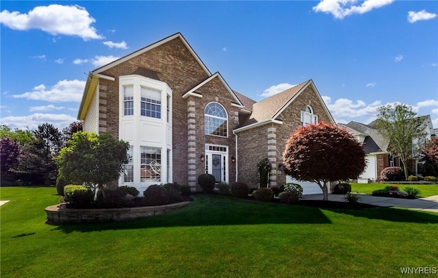 5477 Pebble Beach Dr, Hamburg, NY 14075 - traditional-style home with a front lawn and brick siding