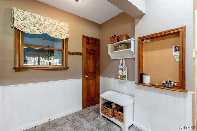 5477 Pebble Beach Dr, Hamburg, NY 14075 - mudroom featuring wainscoting