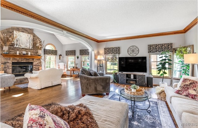 5477 Pebble Beach Dr, Hamburg, NY 14075 - living area with a textured ceiling, a fireplace, wood finished floors, and crown molding
