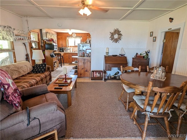 10337 Chaffee Ln, Yates, NY 14098 - living room with a ceiling fan, arched walkways, and a wainscoted wall