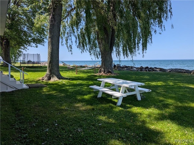 10337 Chaffee Ln, Yates, NY 14098 - view of community with a trampoline, a water view, and a lawn