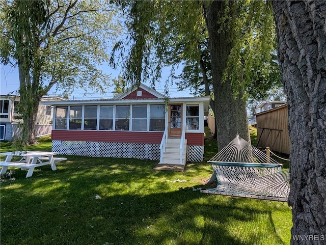 10337 Chaffee Ln, Yates, NY 14098 - rear view of house with a sunroom and a yard