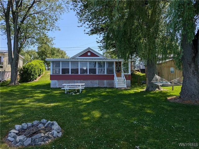 10337 Chaffee Ln, Yates, NY 14098 - rear view of property featuring a sunroom and a lawn