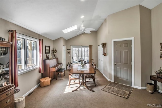 8515 Rte 243, Rushford, NY 14777 - dining room with ceiling fan, carpet flooring, a skylight, and high vaulted ceiling