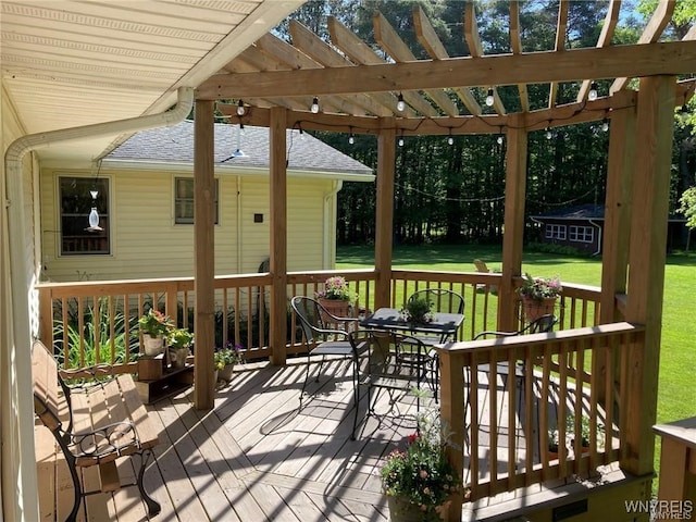 8515 Rte 243, Rushford, NY 14777 - wooden deck with outdoor dining area, a yard, and a pergola