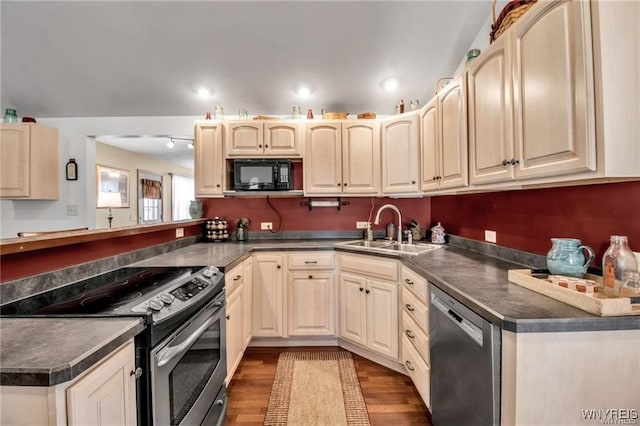 8515 Rte 243, Rushford, NY 14777 - kitchen with appliances with stainless steel finishes, dark countertops, dark wood-style flooring, a peninsula, and recessed lighting