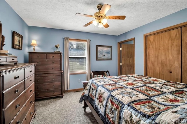 8515 Rte 243, Rushford, NY 14777 - bedroom with light carpet, a closet, a textured ceiling, and ceiling fan