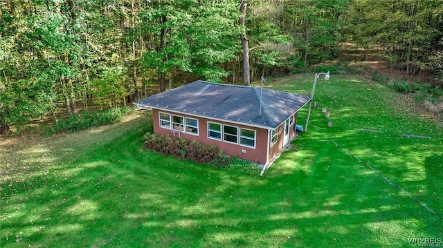 8515 Rte 243, Rushford, NY 14777 - view of property exterior with a yard, a shingled roof, and a view of trees