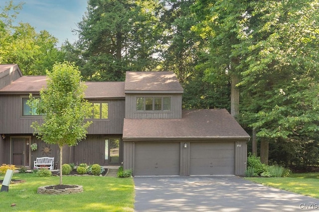 8712 E Patrol Rd, Lysander, NY 13027 - view of front facade featuring a front lawn, a shingled roof, and concrete driveway
