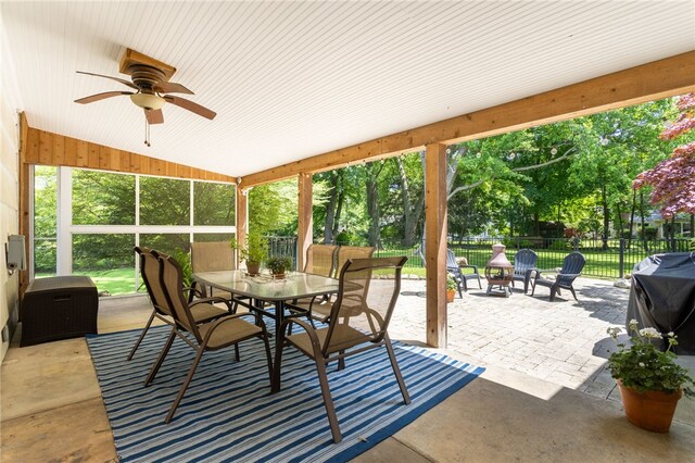 80 Rock Beach Rd, Irondequoit, NY 14617 - sunroom with outdoor dining area, a ceiling fan, and vaulted ceiling