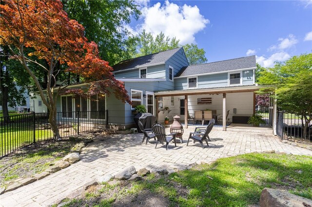 80 Rock Beach Rd, Irondequoit, NY 14617 - rear view of house featuring a patio and a shingled roof