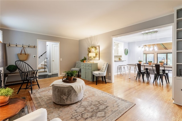 80 Rock Beach Rd, Irondequoit, NY 14617 - living area with wood finished floors, stairs, and ornamental molding