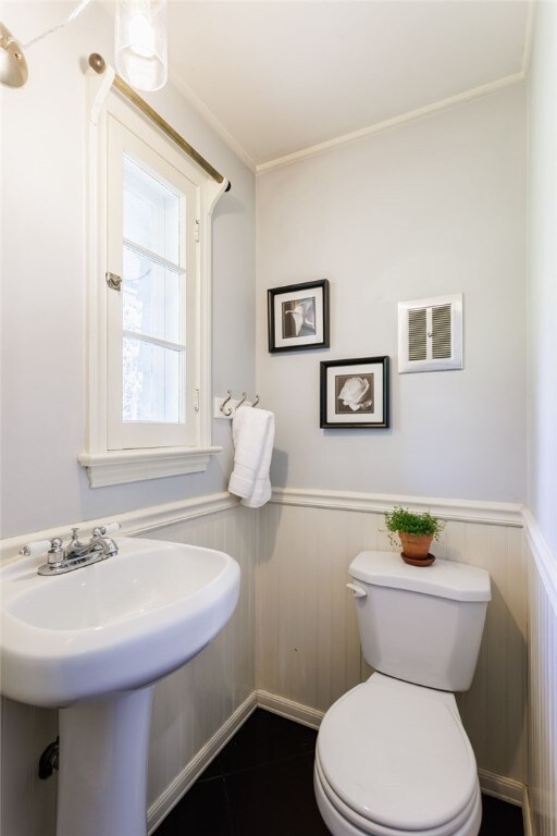 80 Rock Beach Rd, Irondequoit, NY 14617 - bathroom with wainscoting and crown molding