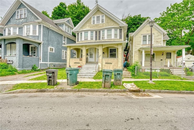 65-67 Woodlawn St, Rochester, NY 14607 - victorian house with a porch