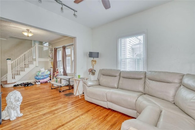 65-67 Woodlawn St, Rochester, NY 14607 - living room with stairway, wood finished floors, track lighting, and ceiling fan