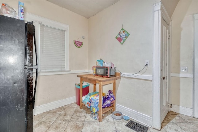 65-67 Woodlawn St, Rochester, NY 14607 - kitchen with freestanding refrigerator and tile patterned floors