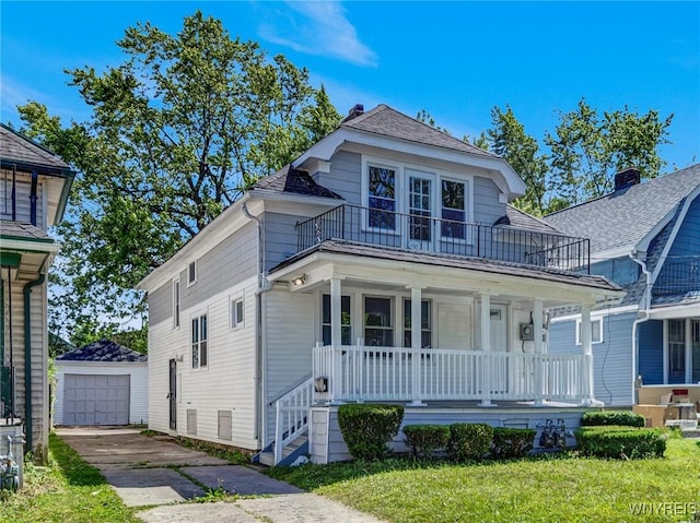 717 Lasalle Ave, Buffalo, NY 14215 - view of front facade with a balcony, covered porch, an outbuilding, driveway, and a detached garage