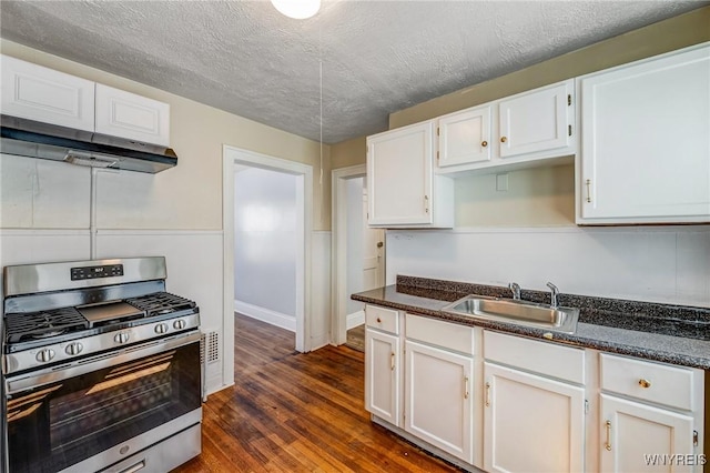 717 Lasalle Ave, Buffalo, NY 14215 - kitchen featuring gas range, range hood, white cabinets, dark wood-style floors, and a textured ceiling