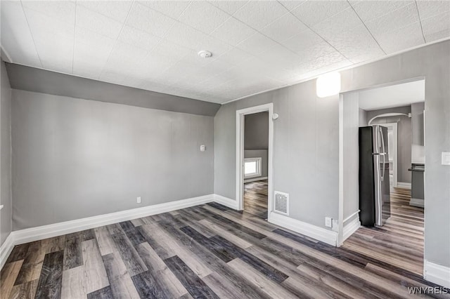 717 Lasalle Ave, Buffalo, NY 14215 - unfurnished room featuring wood finished floors, arched walkways, and a smoke detector