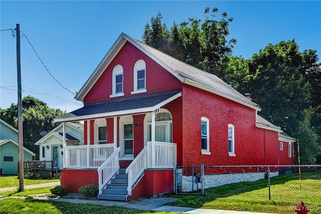 152 Mulberry St, Buffalo, NY 14204 - view of front of house with covered porch, brick siding, and roof with shingles