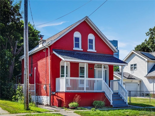 152 Mulberry St, Buffalo, NY 14204 - view of front of property featuring a porch, brick siding, and roof with shingles