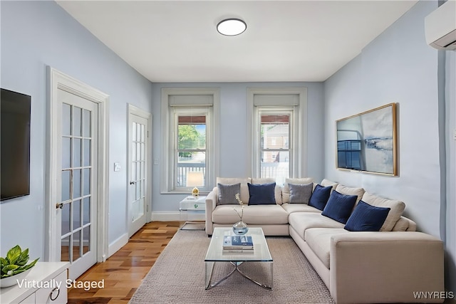 152 Mulberry St, Buffalo, NY 14204 - living room with a wall mounted air conditioner and light wood-type flooring