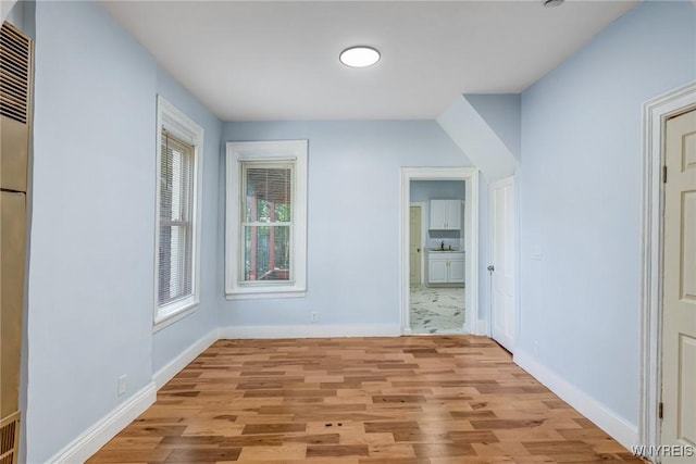 152 Mulberry St, Buffalo, NY 14204 - unfurnished bedroom with light wood finished floors and ensuite bath