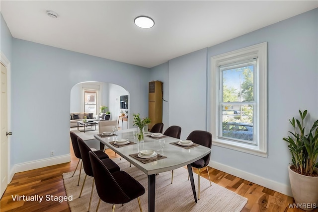 152 Mulberry St, Buffalo, NY 14204 - dining area featuring arched walkways and wood finished floors