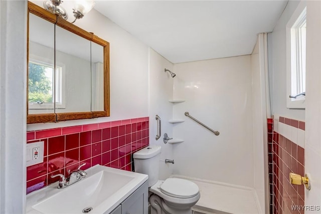 152 Mulberry St, Buffalo, NY 14204 - bathroom featuring tile walls, a shower stall, vanity, and wainscoting