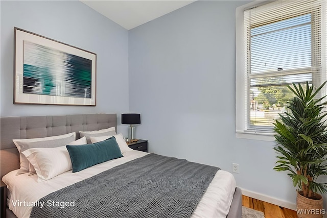 152 Mulberry St, Buffalo, NY 14204 - bedroom with multiple windows and wood finished floors