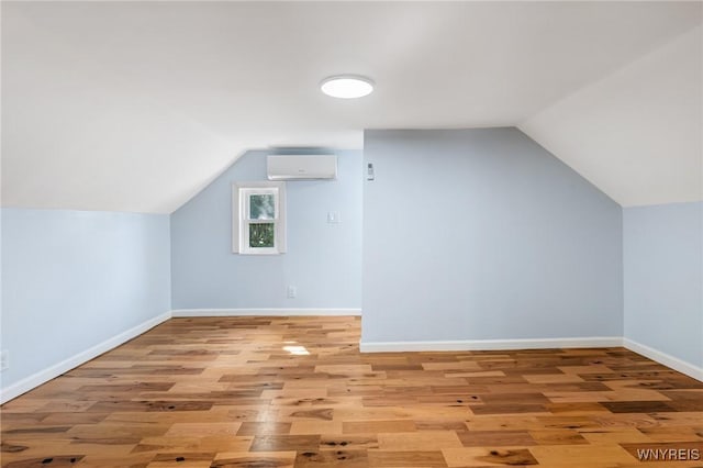 152 Mulberry St, Buffalo, NY 14204 - bonus room with an AC wall unit, vaulted ceiling, and light wood-style flooring