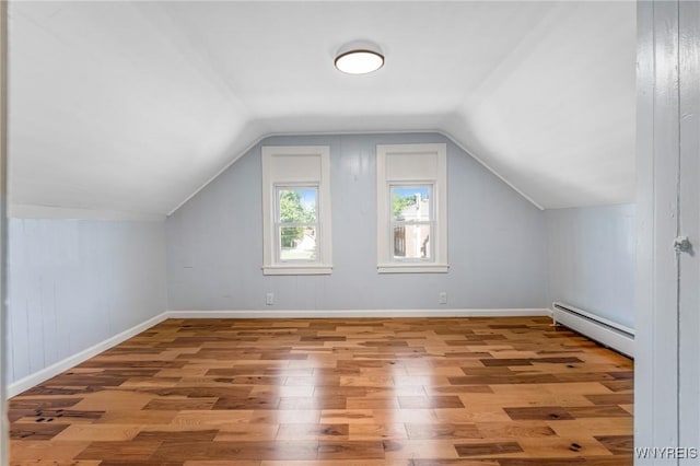 152 Mulberry St, Buffalo, NY 14204 - bonus room with a baseboard heating unit, wood finished floors, and lofted ceiling