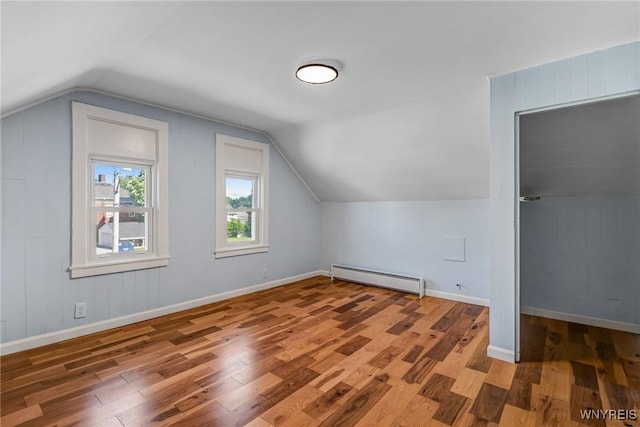 152 Mulberry St, Buffalo, NY 14204 - bonus room with baseboard heating, wood finished floors, and lofted ceiling