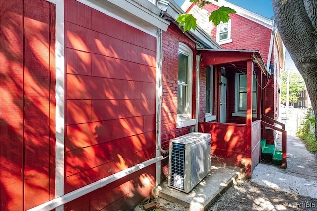 152 Mulberry St, Buffalo, NY 14204 - view of property exterior with brick siding and a cooling unit