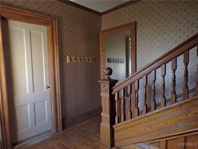 315 Laurens St, Olean-City, NY 14760 - staircase with wallpapered walls, crown molding, and wood finished floors