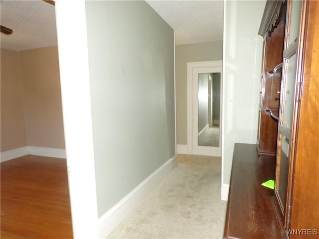315 Laurens St, Olean-City, NY 14760 - corridor with baseboards and a textured ceiling