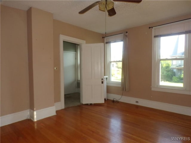 315 Laurens St, Olean-City, NY 14760 - spare room with wood finished floors, a ceiling fan, and a textured ceiling