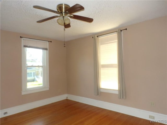 315 Laurens St, Olean-City, NY 14760 - empty room featuring a textured ceiling, wood finished floors, and ceiling fan